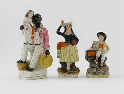 Appraisal: A th century Staffordshire figure of Uncle Tom and Eva