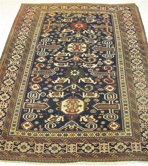 Appraisal: PERISAN WOVEN RUG Woven wool with dark blue ground