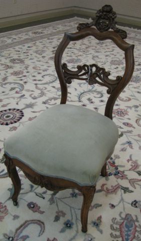 Appraisal: Carved Victorian side chair with padded upholstered seat and caster