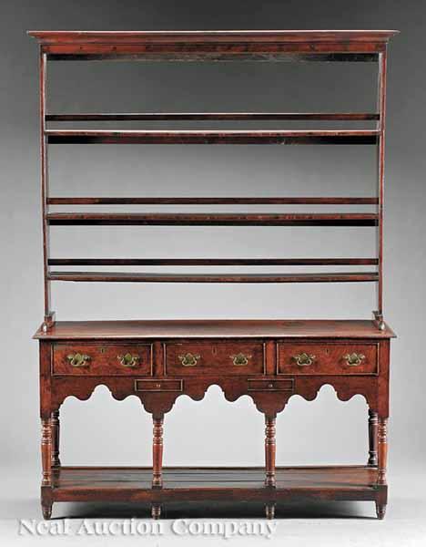 Appraisal: A George III Carved Oak Welsh Dresser late th early