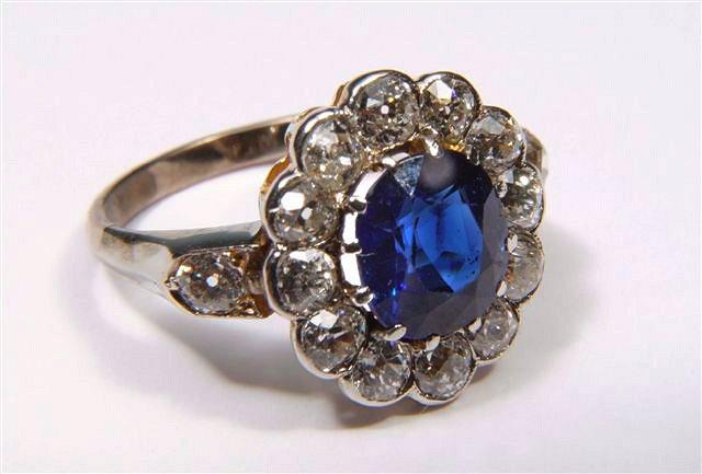 Appraisal: A SAPPHIRE AND DIAMOND DRESS RING claw set oval faceted