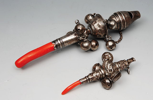 Appraisal: A TH CENTURY SILVER BABY'S RATTLE with coral teething handle