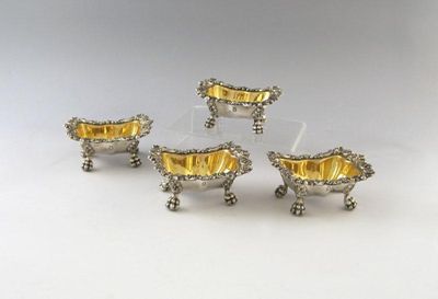 Appraisal: A set of four old Sheffield plated salt cellars shaped