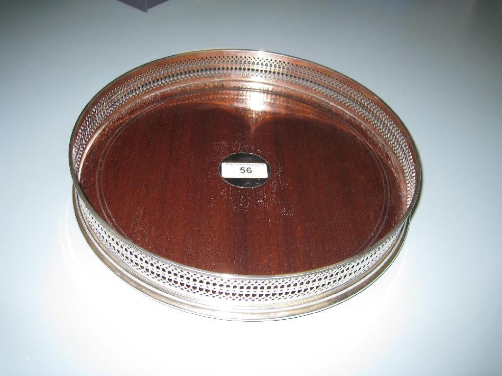 Appraisal: A modern silver mounted pierced circular Drinks Tray with turned