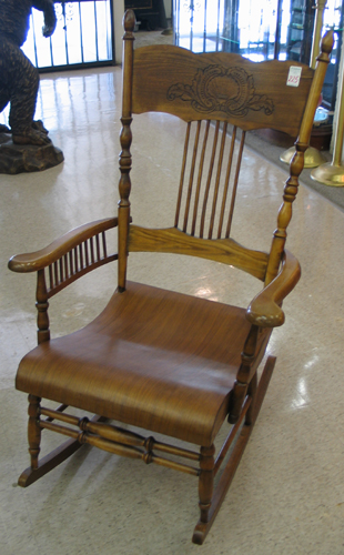 Appraisal: LATE VICTORIAN ROCKING ARMCHAIR American c - having a press-carved