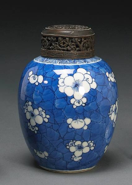 Appraisal: A small blue and white porcelain ovoid jar with wooden