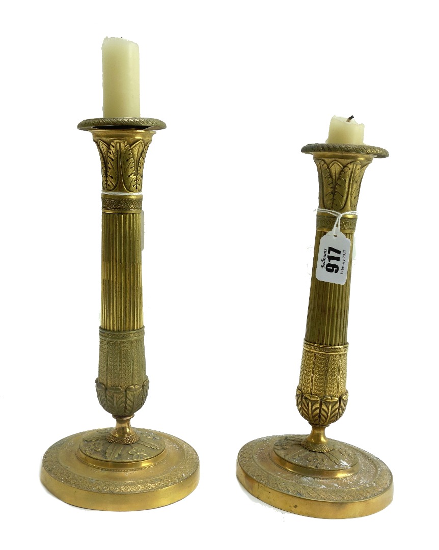 Appraisal: A pair of th century brass candlesticks each of fluted