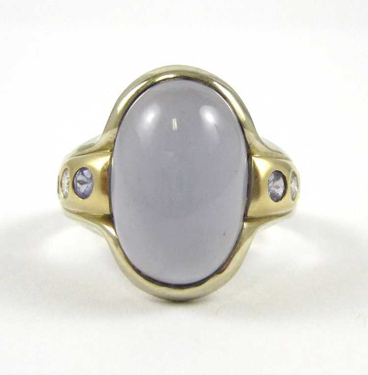 Appraisal: IOLITE DIAMOND AND FOURTEEN KARAT GOLD RING with two round-cut