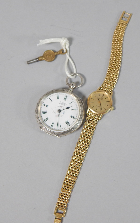 Appraisal: A silver fob watch and a gold plated Omega wristwatch