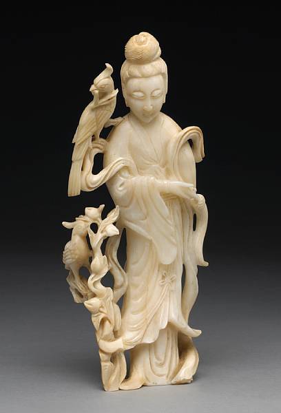 Appraisal: A large carved white coral figure of Guanyin th Century