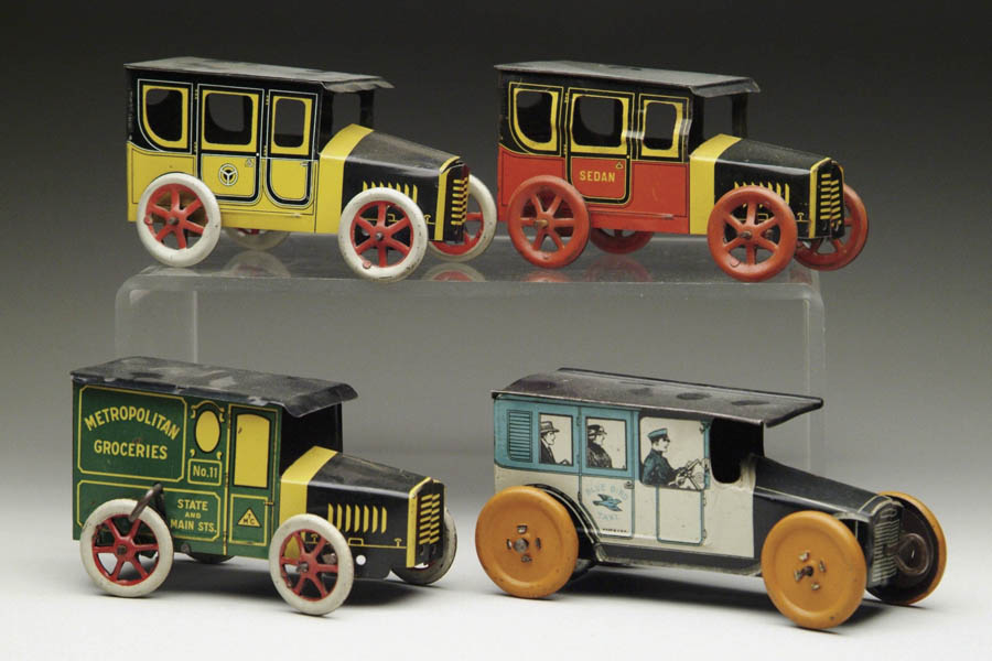 Appraisal: LOT OF FOUR TIN TOY VEHICLES To include a windup