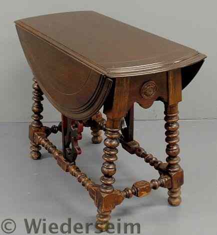 Appraisal: William Mary Style butterfly drop-leaf table c with spool turned