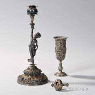 Appraisal: Southeast Asian Silver Figural Candlestick late th early century the