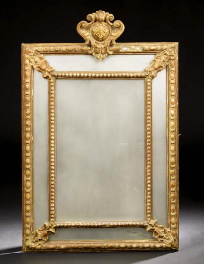 Appraisal: Italian Giltwood Looking Glass mid- th century of cushion form