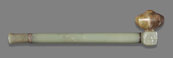 Appraisal: A pieced jade and metal opium pipe The separate mouth