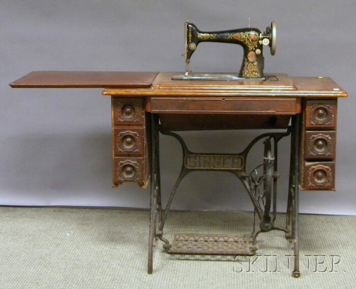 Appraisal: Singer Victorian Treadle-powered Sewing Machine with Walnut Cabinet