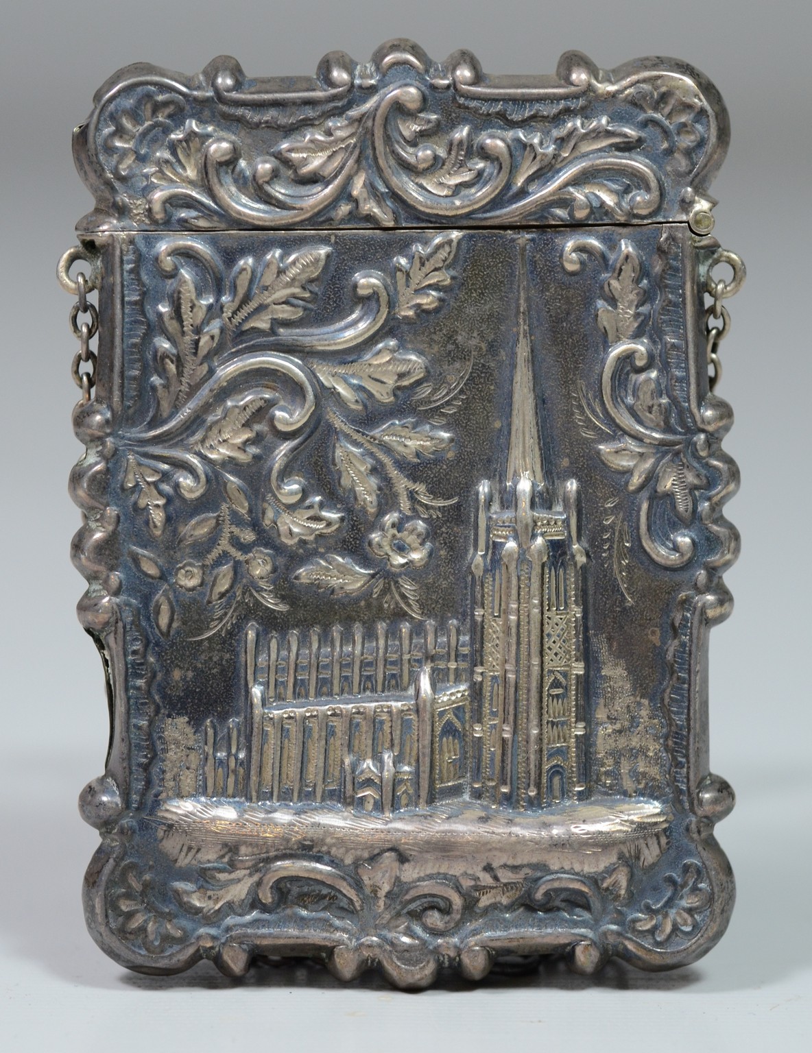 Appraisal: Unmarked repousse silver card case Trinity Church New York City