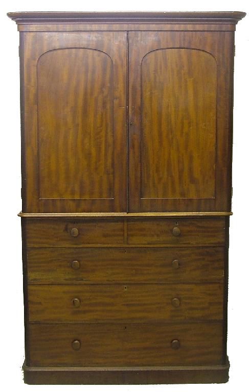 Appraisal: Victorian mahogany linen press with arched panelled doors over two