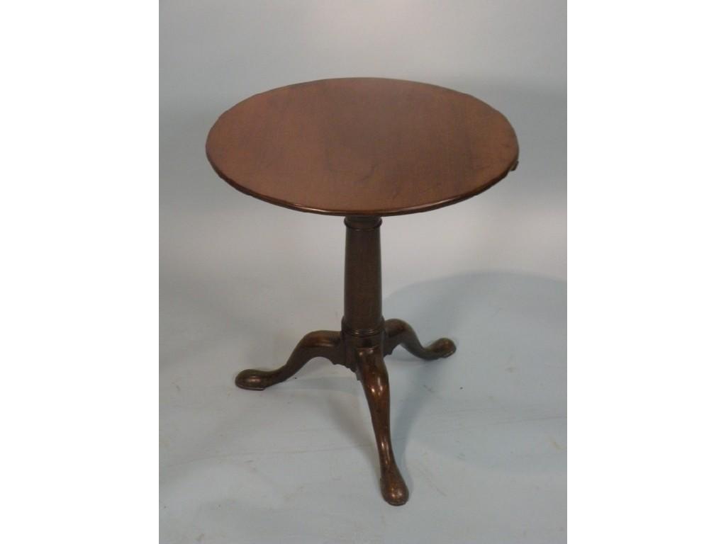 Appraisal: A George III mahogany tilt top table the circular top