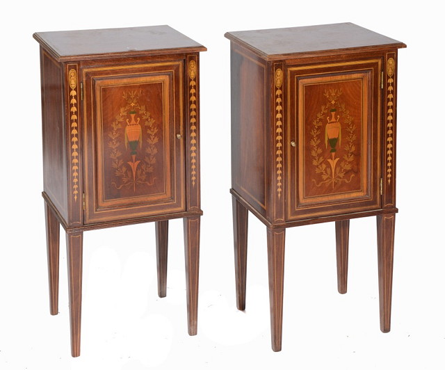 Appraisal: A PAIR OF EDWARDIAN MAHOGANY POT CUPBOARDS enclosed by single