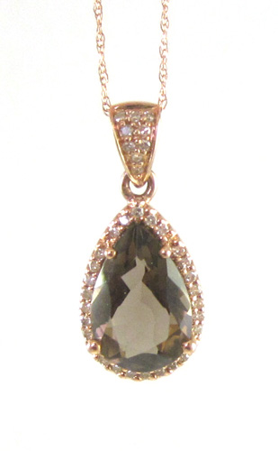 Appraisal: SMOKY TOPAZ AND DIAMOND PENDANT NECKLACE suspended on a k