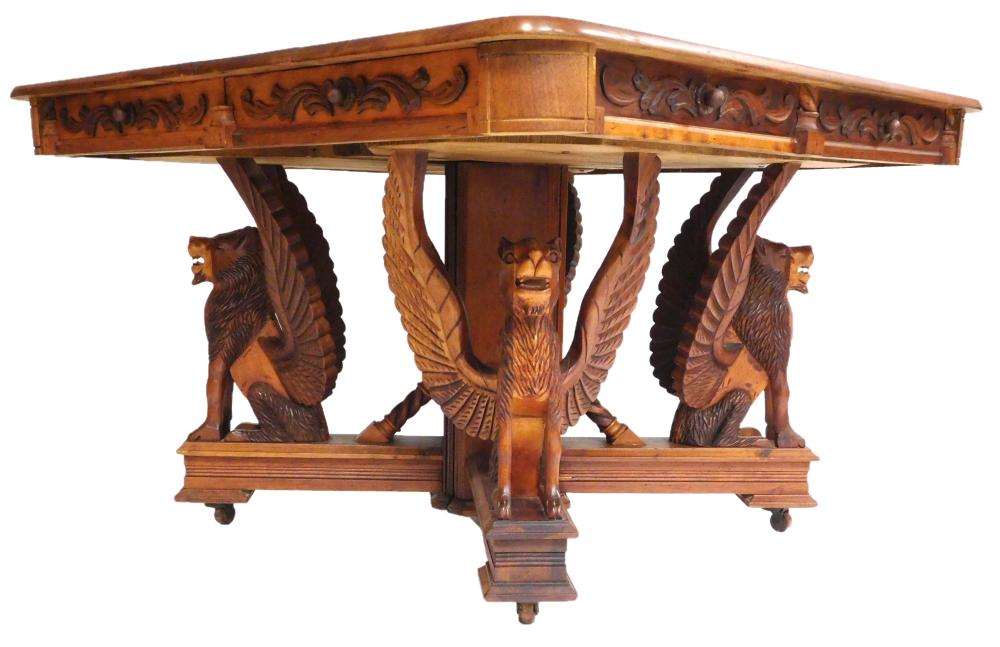 Appraisal: Late Victorian dining table with carved griffin base late th