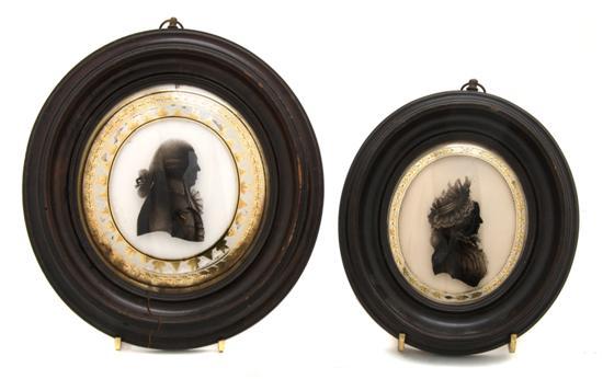 Appraisal: A Pair of Silhouettes Beetham each reverse painted bust on