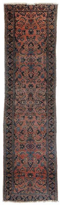 Appraisal: Sarouk Runner Persian early th century raspberry ground navy and