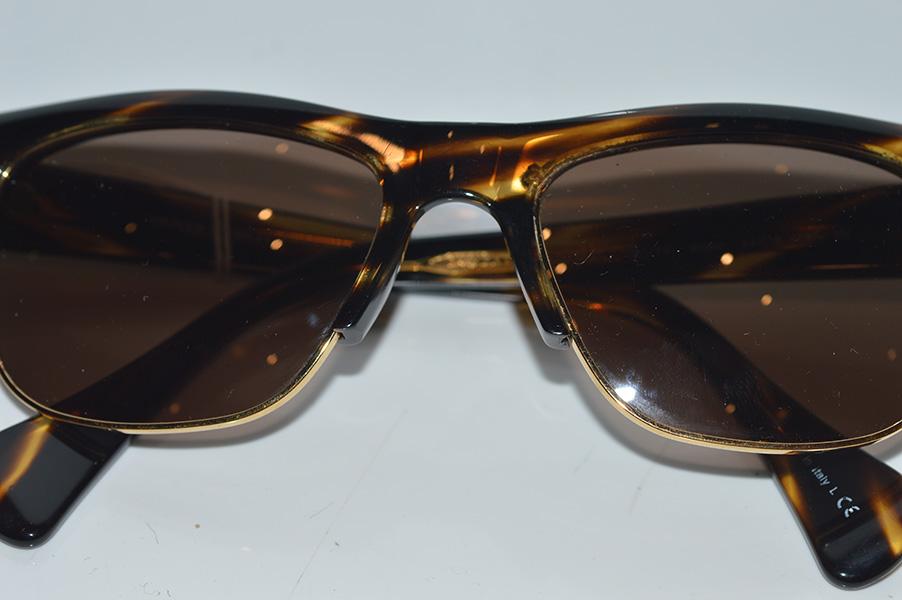 Appraisal: A PAIR OF OLIVER PEOPLES SUNGLASSES WITH TORTOISE SHELL AND