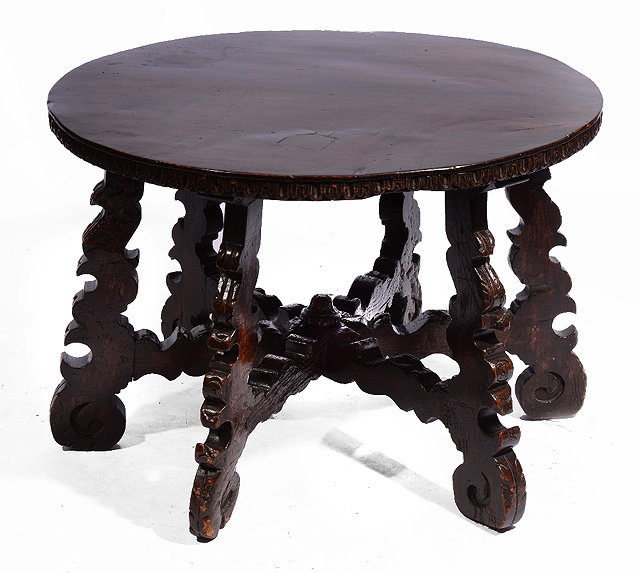 Appraisal: AN ANTIQUE SPANISH OAK CIRCULAR CENTRE TABLE on six scroll