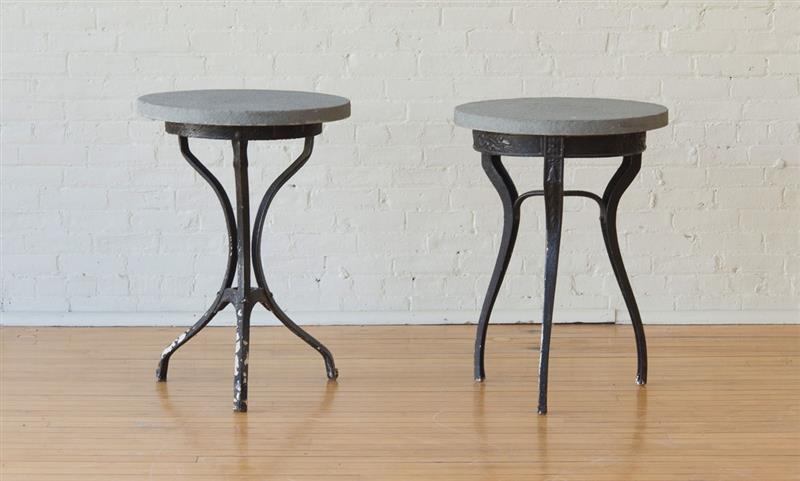 Appraisal: TWO CAST-IRON STONE-TOP GARDEN TABLES Largest x in diam Estimate