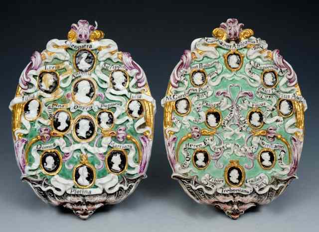 Appraisal: A PAIR OF CONTINENTAL BISQUE WALL PLAQUES each of green