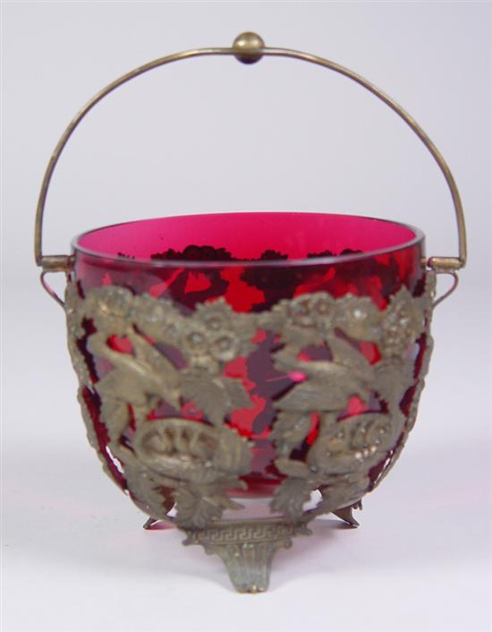 Appraisal: Footed Brass Basket with Cranberry Blown Glass Insert Brass molded