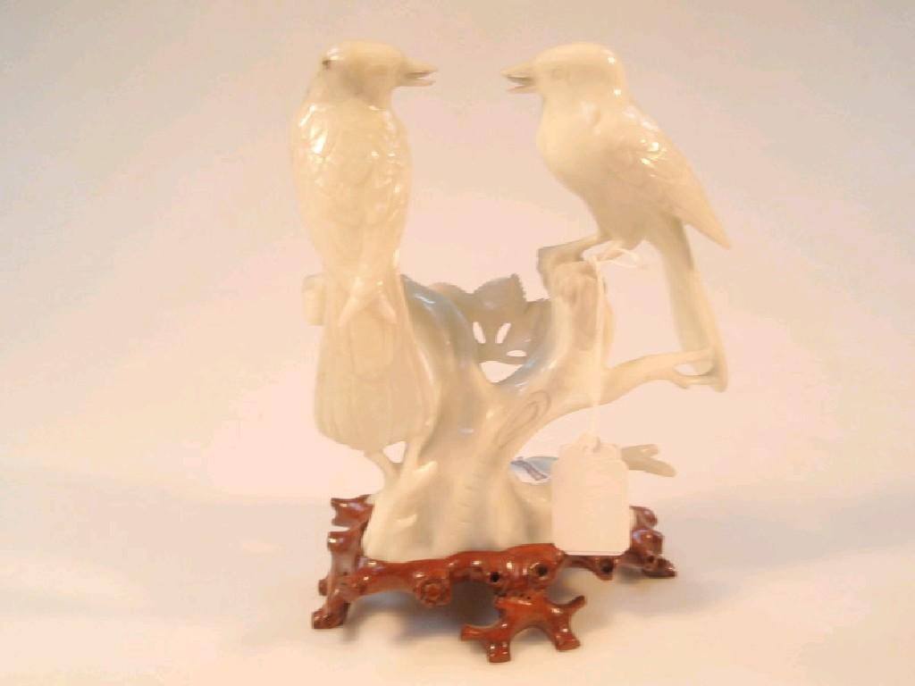 Appraisal: A Chinese Celadon hard stone group of two birds on