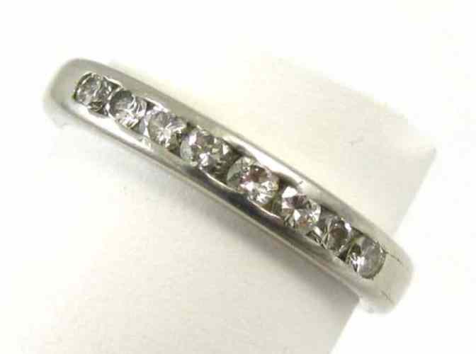 Appraisal: DIAMOND AND PLATINUM RING set with eight round-cut diamonds together