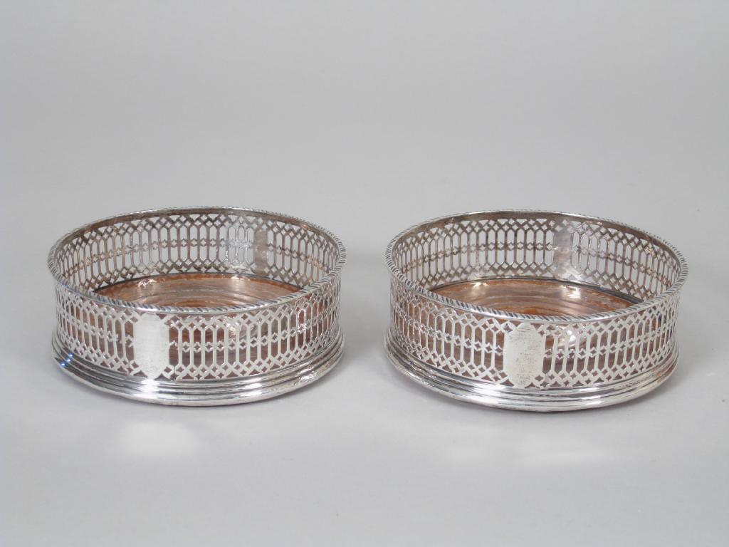 Appraisal: Pair of George III pierced circular Coasters with gadroon rims