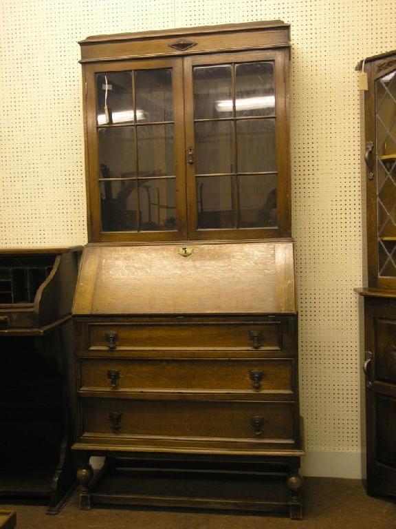 Appraisal: A solid medium oak bureau bookcase bookcase with two glazed