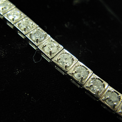 Appraisal: DIAMOND AND FOURTEEN KARAT WHITE GOLD TENNIS BRACELET WITH APPRAISAL