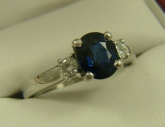 Appraisal: DIAMOND AND BLUE SAPPHIRE RING platinum setting estimated weight of