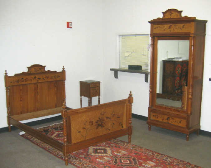 Appraisal: CONTINENTAL PINE AND INLAID BEDROOM SET Three pieces including a