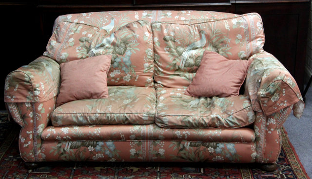 Appraisal: An upholstered two-seater sofa cm wide