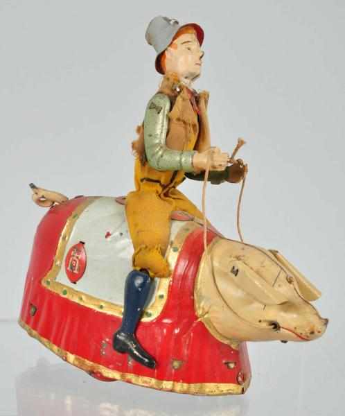 Appraisal: Tin Lehmann Paddy on the Pig Wind-Up Toy Description German