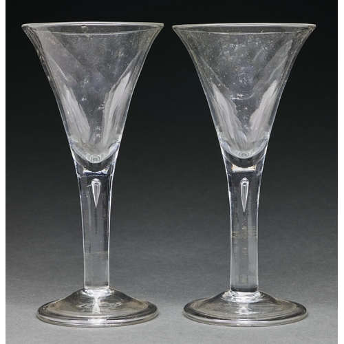 Appraisal: A pair of English wine glasses of unusually large size