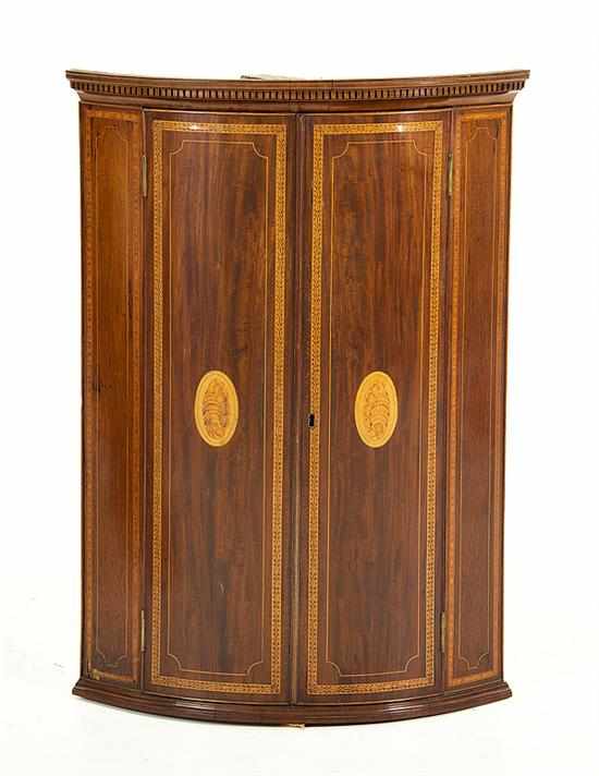 Appraisal: George III inlaid mahogany bowfront hanging corner cabinet early th