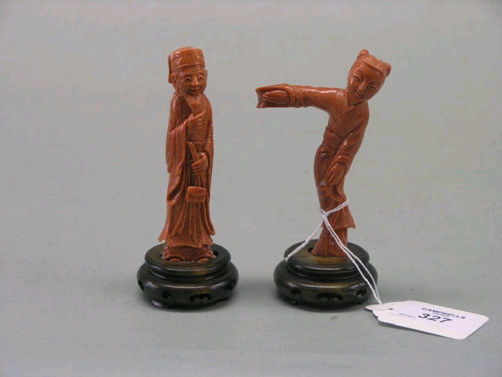 Appraisal: A pair of Chinese carved figures possibly coral bearded gentleman