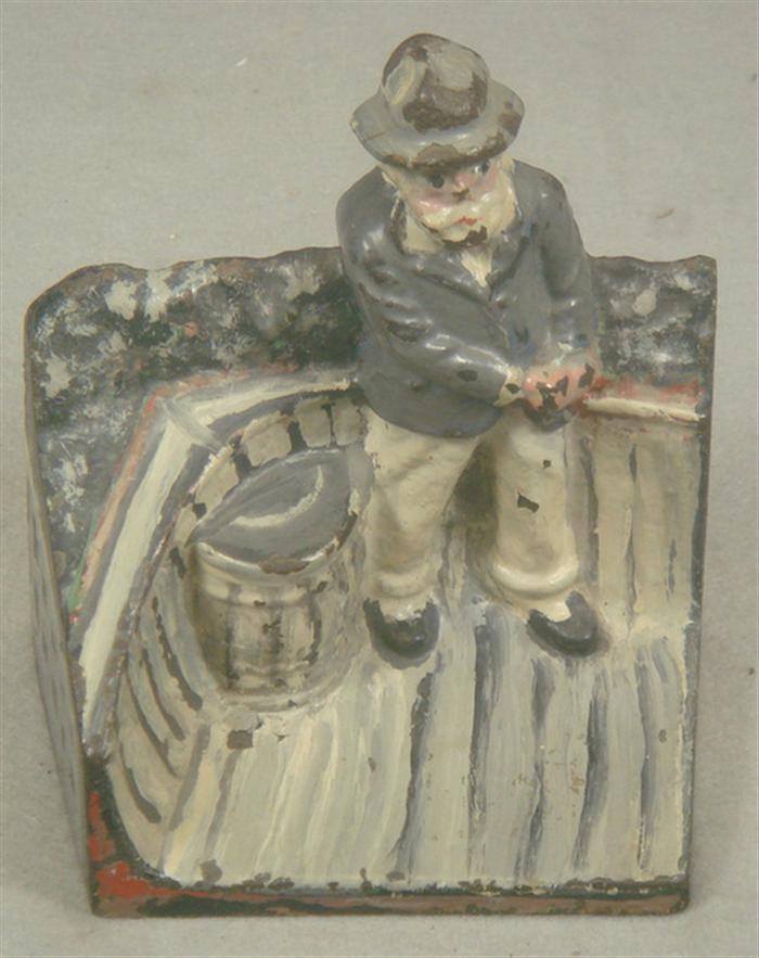 Appraisal: Cast iron doorstop old man with hat standing on dock