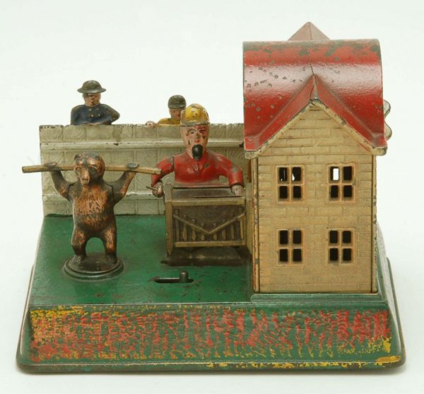 Appraisal: Organ Grinder and Bear cast iron mechanical bank Circa 's