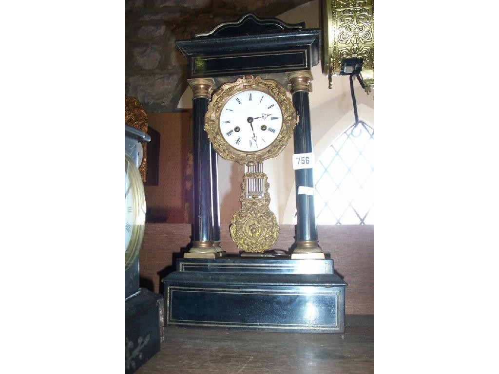 Appraisal: A th century ebonised and brass inlaid portico clock with