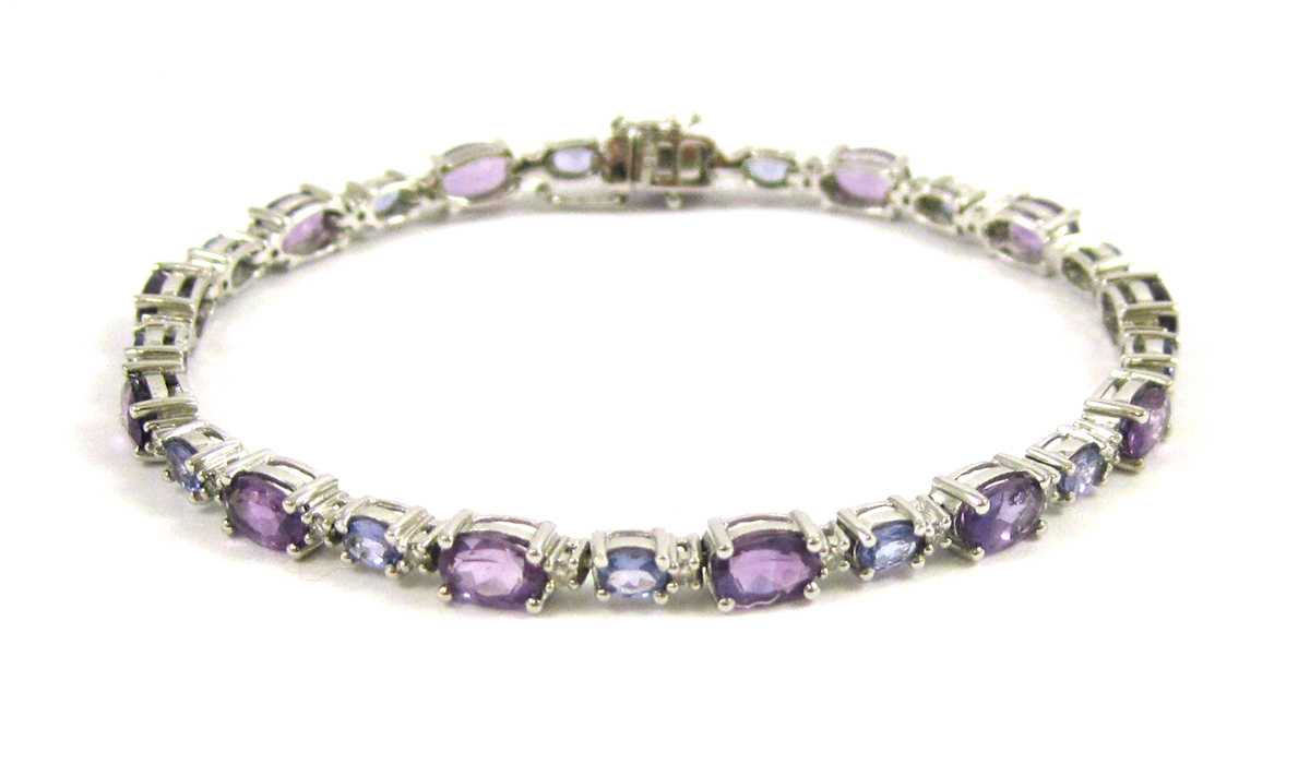 Appraisal: AMETHYST TANZANITE AND DIAMOND BRACELET The k white gold bracelet