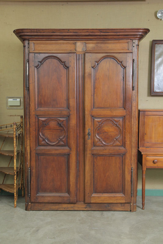 Appraisal: EARLY ARMOIRE Possibly French Step molded cornice over two large